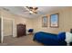 Comfortable bedroom features a cozy bed, built-in desk, and natural light creating a relaxing space at 5231 W Desperado Way, Phoenix, AZ 85083