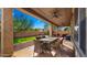 Covered patio featuring an outdoor dining area, ceiling fans, and an amazing backyard at 5231 W Desperado Way, Phoenix, AZ 85083