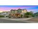 Beautiful two-story home with a three-car garage, stone accents, and professional landscaping at 5231 W Desperado Way, Phoenix, AZ 85083