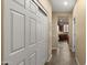 Hallway that connects to the kitchen. Features access to multiple rooms in the house at 5231 W Desperado Way, Phoenix, AZ 85083