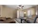 Bright home office with a desk and comfortable seating and featuring great natural light through plantation shutters at 5231 W Desperado Way, Phoenix, AZ 85083
