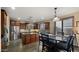 This gourmet kitchen offers dark wood cabinets, a large island, and plenty of dining space at 5231 W Desperado Way, Phoenix, AZ 85083