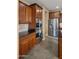 Kitchen with tile floors, stainless appliances, dark wood cabinets and granite countertops at 5231 W Desperado Way, Phoenix, AZ 85083