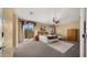 Spacious main bedroom with a balcony, natural light, and a comfortable seating area at 5231 W Desperado Way, Phoenix, AZ 85083
