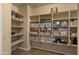 Walk-in pantry features ample shelving and storage for all of your cooking needs at 5231 W Desperado Way, Phoenix, AZ 85083