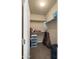 Functional walk-in closet with built-in shelves, ample storage space, and neutral paint at 5231 W Desperado Way, Phoenix, AZ 85083