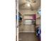 Spacious walk-in closet with ample shelving and hanging storage, and a ceiling fan for added comfort at 5231 W Desperado Way, Phoenix, AZ 85083