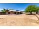 Spacious backyard featuring a covered patio, a large tree, and a well-defined fence line at 525 N 94Th Way, Mesa, AZ 85207
