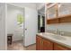 Bathroom featuring a vanity with wood cabinets and a toilet in a separate room at 525 N 94Th Way, Mesa, AZ 85207