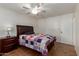 This bedroom has neutral walls, a ceiling fan, closet, and a tiled floor at 525 N 94Th Way, Mesa, AZ 85207
