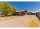 Desert home with a spacious driveway and minimalist landscaping at 525 N 94Th Way, Mesa, AZ 85207