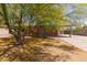 Cozy home featuring desert landscaping and a charming tree at 525 N 94Th Way, Mesa, AZ 85207