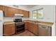 Kitchen featuring stainless steel appliances and wooden cabinets at 525 N 94Th Way, Mesa, AZ 85207