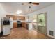 Functional kitchen with tile flooring, wood cabinets, and stainless steel appliances at 525 N 94Th Way, Mesa, AZ 85207