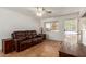 Comfortable living area with large window, neutral walls, and tile flooring at 525 N 94Th Way, Mesa, AZ 85207