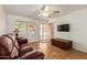 Cozy living room with leather sofa, television, and tile floors at 525 N 94Th Way, Mesa, AZ 85207
