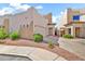 Inviting exterior view with desert landscaping, a private courtyard, and a two-car garage at 544 N Alma School Rd # 28, Mesa, AZ 85201