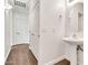 Stylish powder room with pedestal sink, modern fixtures, and wood-look floors at 544 N Alma School Rd # 28, Mesa, AZ 85201