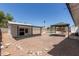 Fully enclosed backyard with a pool, rock landscaping, pool house, and covered patio at 632 N 95Th St, Mesa, AZ 85207