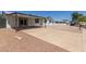 Single-story home featuring a concrete driveway and low-maintenance rock landscaping at 632 N 95Th St, Mesa, AZ 85207