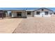 Charming single-story home with a xeriscaped front yard and covered parking at 632 N 95Th St, Mesa, AZ 85207