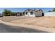 Single-story home with rock landscaping, dark trim and a covered patio at 632 N 95Th St, Mesa, AZ 85207