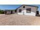 Home with dark trim, white siding, covered patio and rock landscaping at 632 N 95Th St, Mesa, AZ 85207