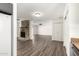 Open-concept living space with a stone fireplace and views into the kitchen at 632 N 95Th St, Mesa, AZ 85207