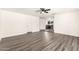 Open-concept living area showcases stylish gray wood-look flooring and access to the kitchen at 632 N 95Th St, Mesa, AZ 85207
