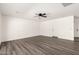 Well-lit living room featuring gray wood-look flooring and neutral walls for versatile decor at 632 N 95Th St, Mesa, AZ 85207