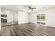 Inviting living room boasts gray wood-look flooring and abundant natural light at 632 N 95Th St, Mesa, AZ 85207