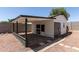 Pool house exterior featuring a covered patio, painted brick, and decorative rock landscaping at 632 N 95Th St, Mesa, AZ 85207