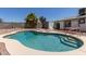 Enjoy this kidney-shaped pool with tanning ledge and steps for easy access at 632 N 95Th St, Mesa, AZ 85207