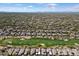 This high-altitude shot shows many homes, desert vegetation, and a meticulously kept golf course at 6579 E Shooting Star Way, Scottsdale, AZ 85266
