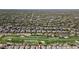 Expansive aerial view of a neighborhood with a golf course and desert landscaping, showcasing the community's layout and design at 6579 E Shooting Star Way, Scottsdale, AZ 85266