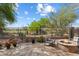 Inviting backyard features a fire pit, lush landscaping, and views of the community golf course at 6579 E Shooting Star Way, Scottsdale, AZ 85266