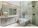 Spa-like bathroom features a soaking tub, glass shower, double sinks and modern fixtures at 6579 E Shooting Star Way, Scottsdale, AZ 85266