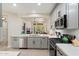 Well-equipped kitchen offering a view of the cozy living room with a fireplace and ample natural light at 6579 E Shooting Star Way, Scottsdale, AZ 85266