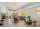 Bright living room featuring a fireplace, patio access, and large windows offering ample natural light at 6579 E Shooting Star Way, Scottsdale, AZ 85266