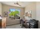 Comfortable office space features a large window overlooking lush landscaping and natural sunlight at 6579 E Shooting Star Way, Scottsdale, AZ 85266
