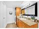 Well-lit bathroom with granite countertops, vanity, and convenient in-unit laundry at 7350 N Via Paseo Del Sur -- # O202, Scottsdale, AZ 85258