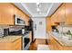 Modern kitchen boasts stainless steel appliances, granite counters, and ample wood cabinetry at 7350 N Via Paseo Del Sur -- # O202, Scottsdale, AZ 85258
