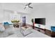 Living room with open-concept design, dark wood flooring, and access to the dining area at 7350 N Via Paseo Del Sur -- # O202, Scottsdale, AZ 85258