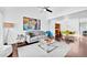 Living room with open-concept design, dark wood flooring, and access to the dining area at 7350 N Via Paseo Del Sur -- # O202, Scottsdale, AZ 85258