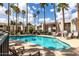 Community pool surrounded by lounge chairs, perfect for relaxing and soaking up the sun at 7350 N Via Paseo Del Sur -- # O202, Scottsdale, AZ 85258