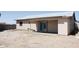The back of the home has a covered patio and sliding glass doors at 749 N 99Th St, Mesa, AZ 85207