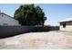 The backyard features a block fence and a wood gate at 749 N 99Th St, Mesa, AZ 85207