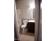 Bathroom featuring a toilet, vanity with dark wood cabinets, and a tiled backsplash at 749 N 99Th St, Mesa, AZ 85207