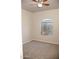 Bright carpeted bedroom featuring a window at 749 N 99Th St, Mesa, AZ 85207