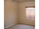 This carpeted bedroom features a ceiling fan and wood blinds at 749 N 99Th St, Mesa, AZ 85207